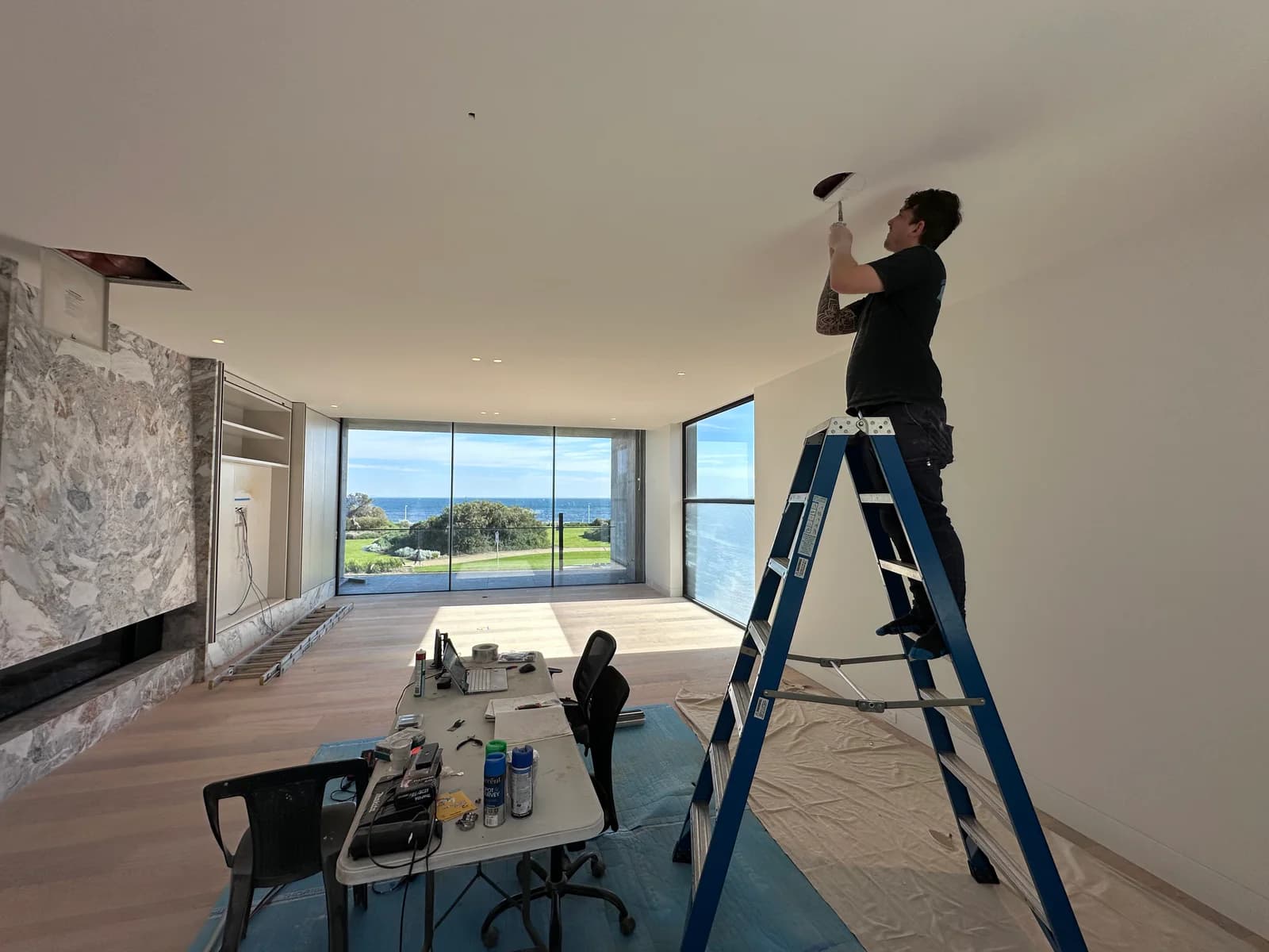 NorthTech technician working on ceiling equipment in a customer’s home