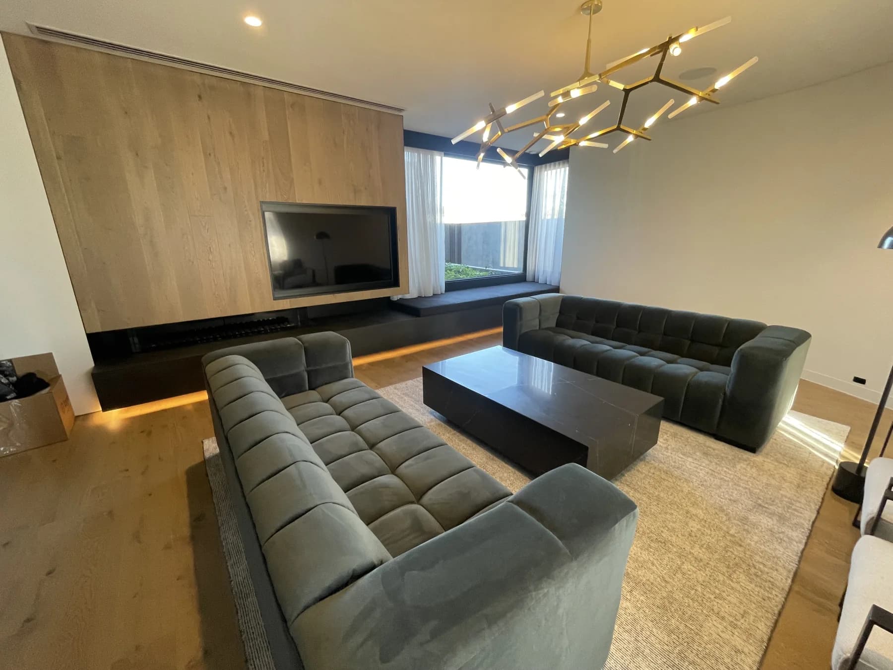 Essendon living room with a television and seating